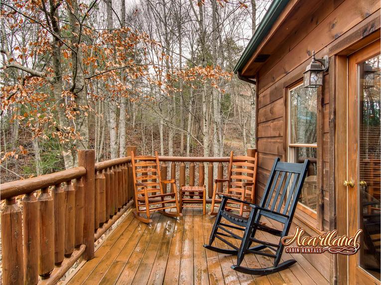 Wooden rocking chairs on the back deck with hot tub - perfect for your morning cup of coffee